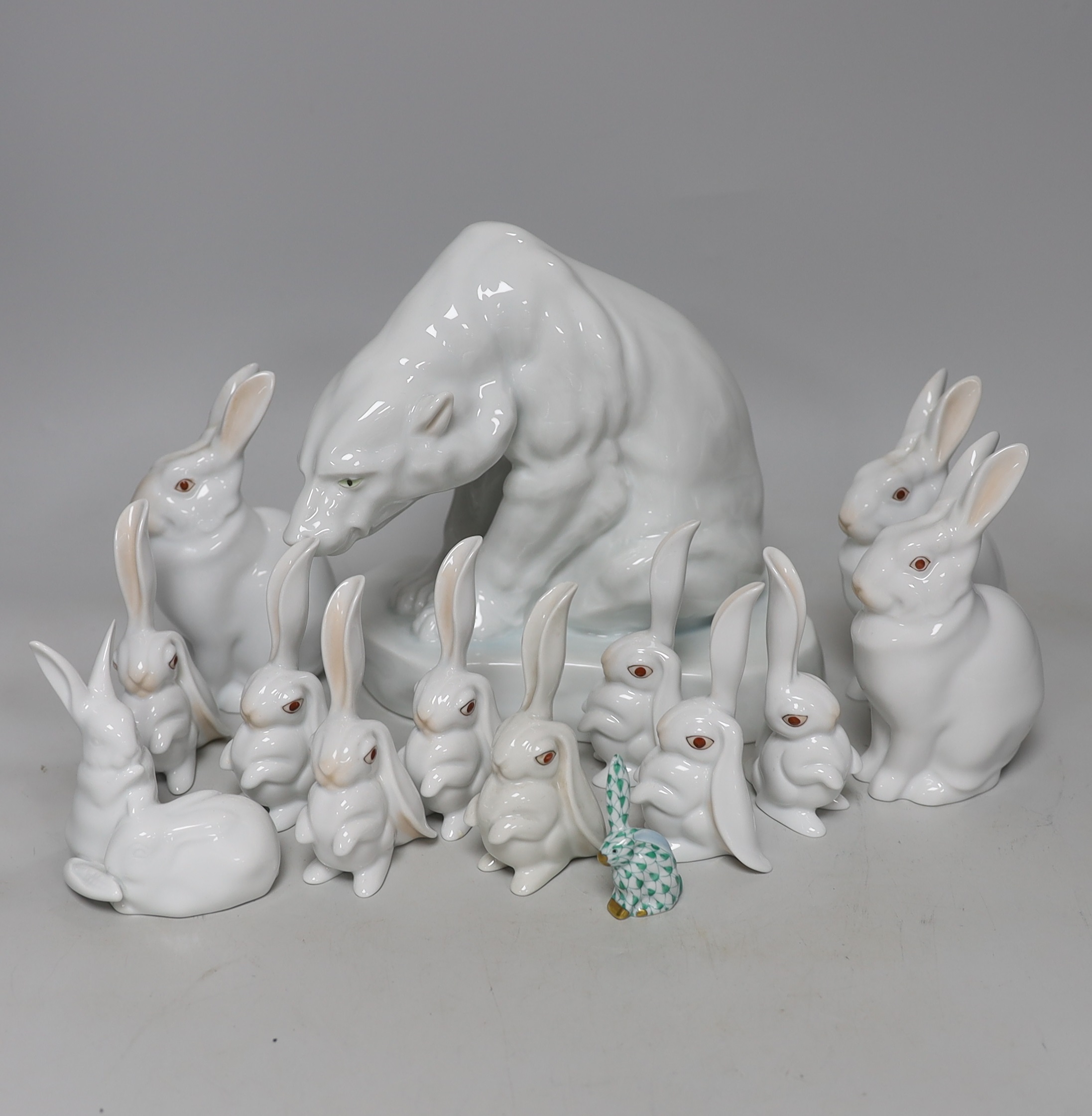 An Herend Polar bear and three sets of four graduated white glazed rabbits and a single green glazed rabbit, all by Herend Polar bear, 20cm high (14)